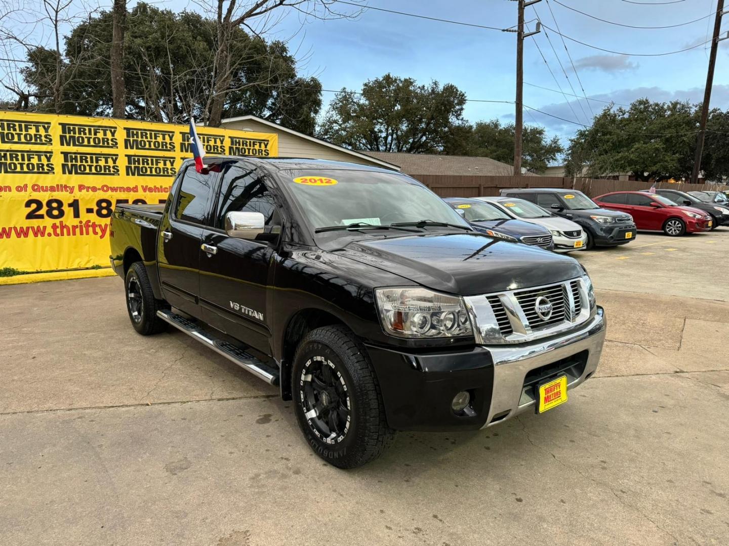 2012 Nissan Titan (1N6BA0ED2CN) , located at 16710 Clay Rd., Houston, TX, 77084, (281) 859-7900, 29.834864, -95.656166 - Photo#4